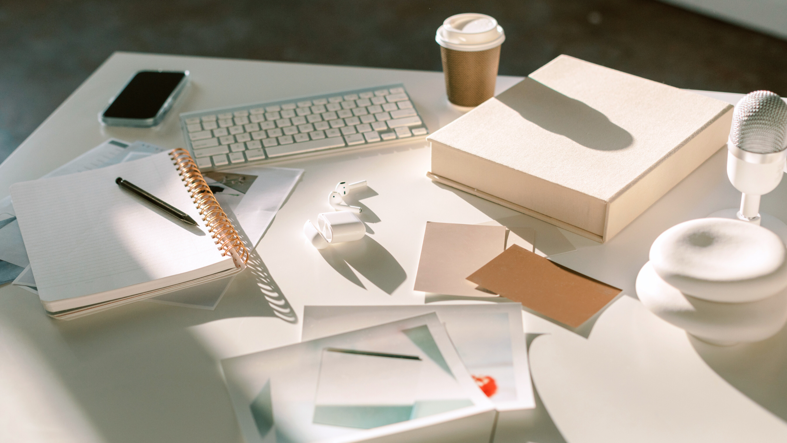 View of coach's desk with elements to help her create a high-ticket offer.